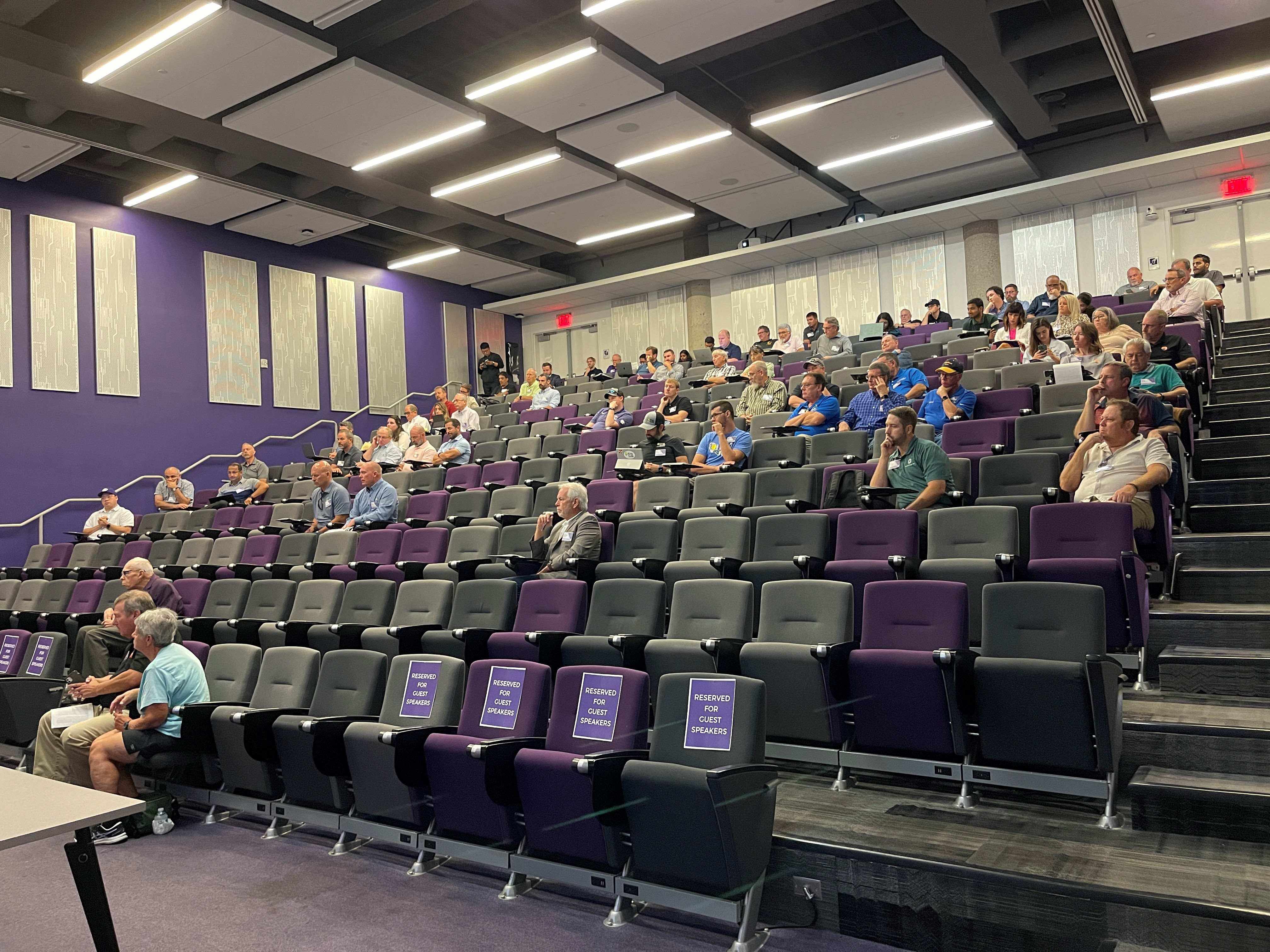 Symposium attendees in lecture hall